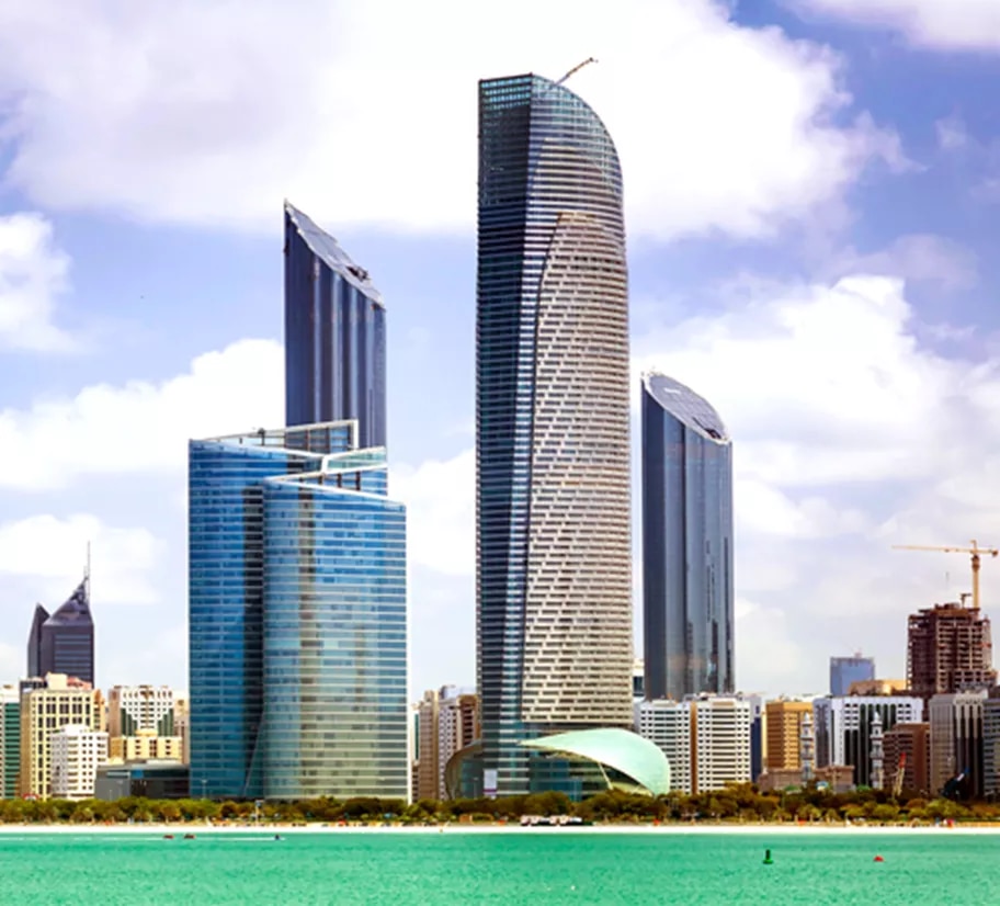 The World Trade Center Abu Dhabi, a distinctive cluster of modern skyscrapers with curved and angular designs, rising along the city’s waterfront and forming a key part of the capital’s skyline.